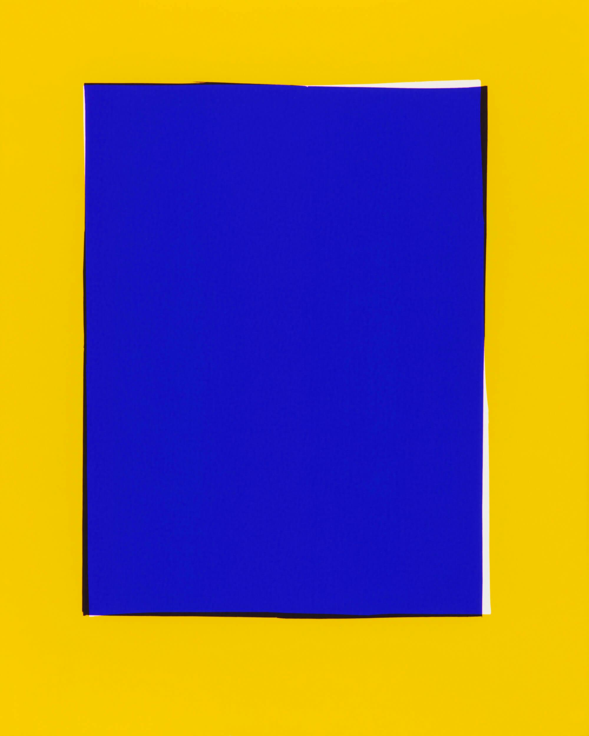 A solid blue square is centered on a bright yellow background. The blue square has sharp edges and stands out against the contrasting yellow.