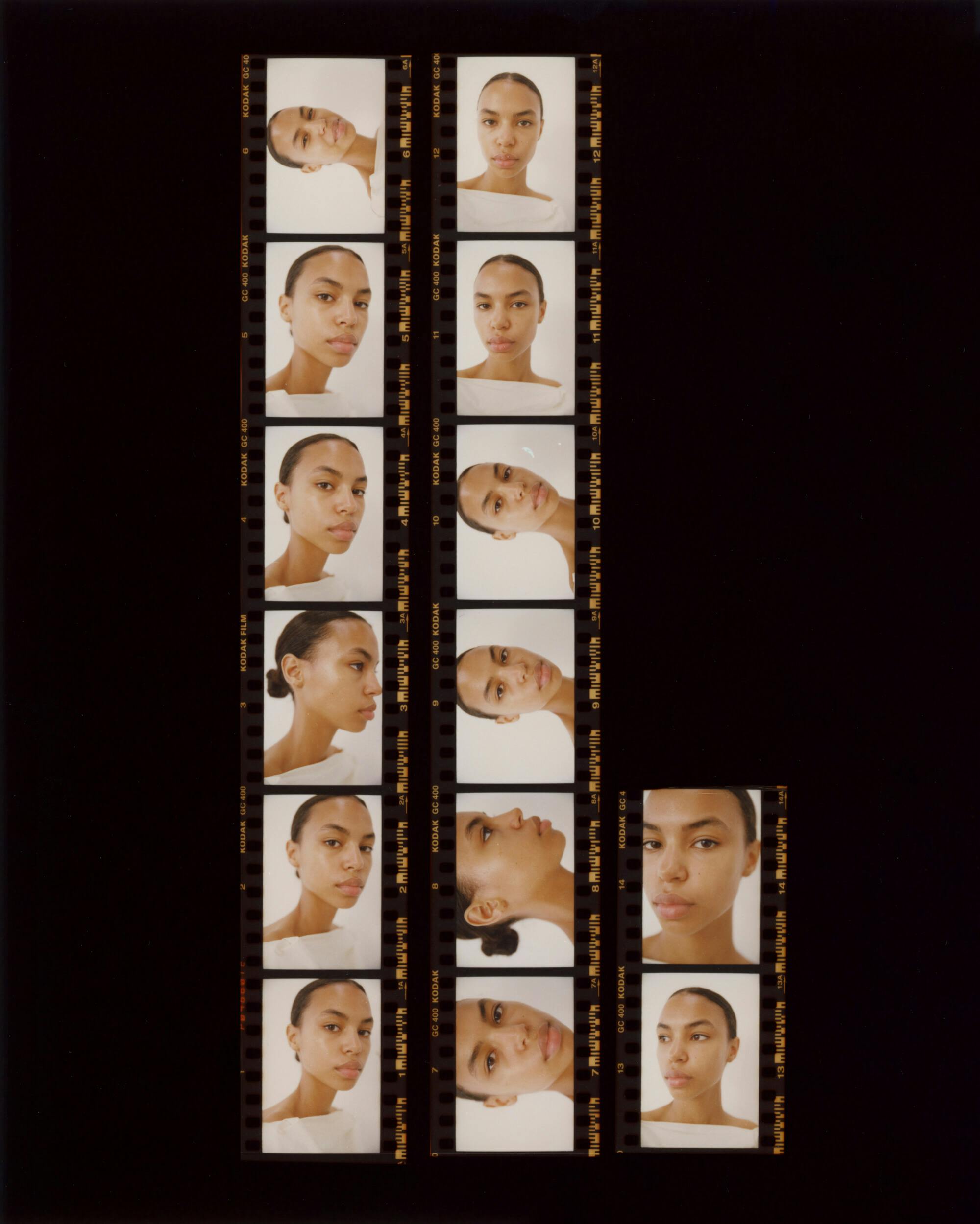 A photographic contact sheet displays multiple headshots of a person with short hair against a neutral background, showing various facial expressions and angles, arranged in three vertical strips on a black surface.