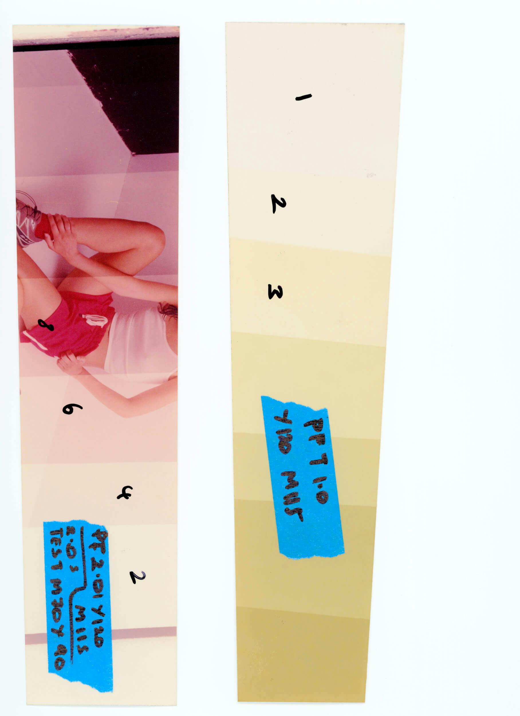 Two vertical strips are shown. The left strip has part of a photo with people, labeled with handwritten numbers and blue tape. The right strip is a beige paint sample with numbers 1 to 3 and blue tape with black writing.