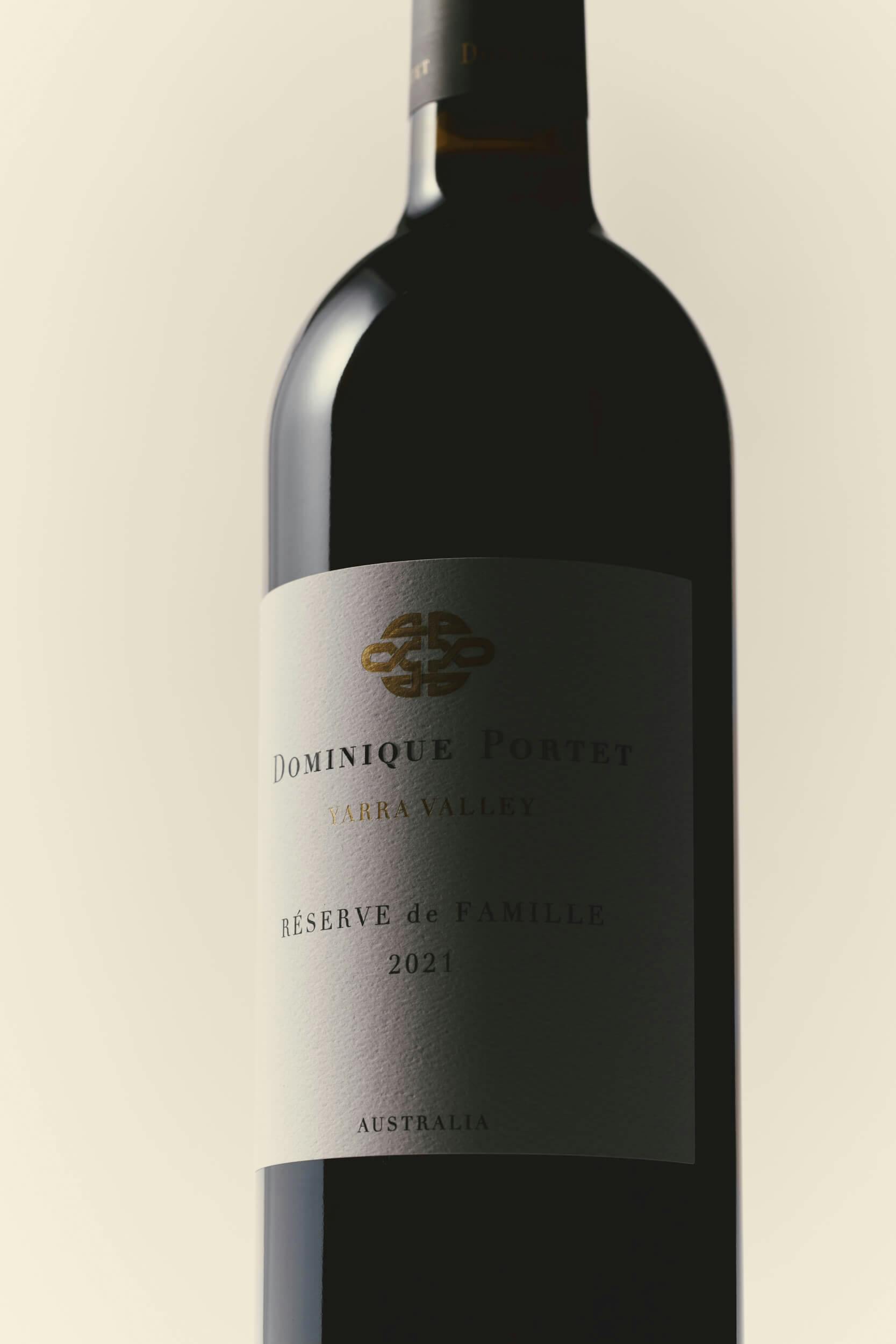 A bottle of red wine with a label reading 