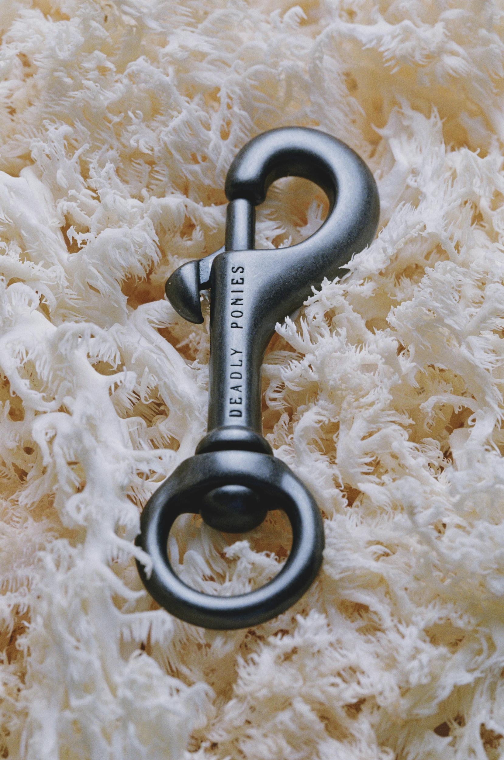 A metal key on a white surface.